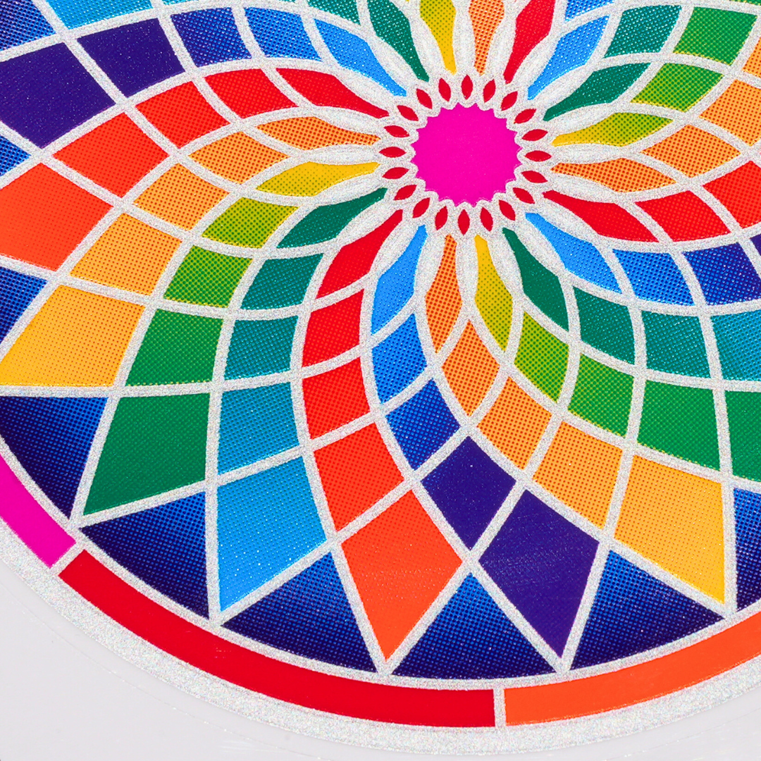 Färgglatt klistermärke med mandala-mönster i flera nyanser och en cirkulär form
