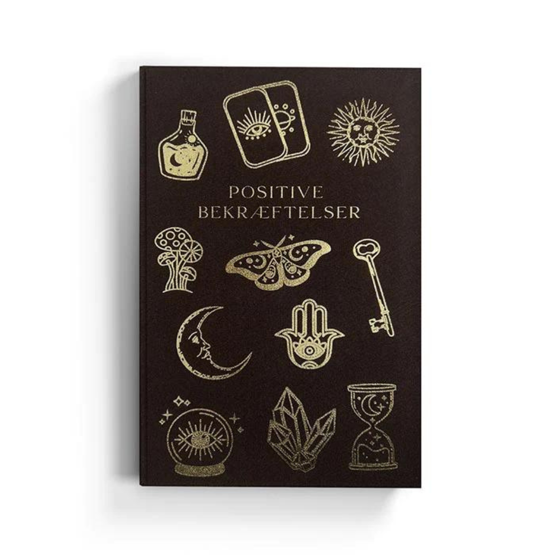 Svart bok med guldiga symboler och texten Positivt Bekräftelser